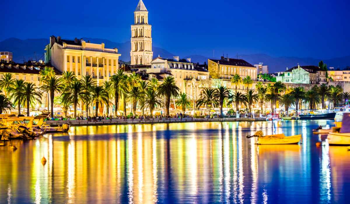 : Split Riva promenade at sunset with palm trees and sea view